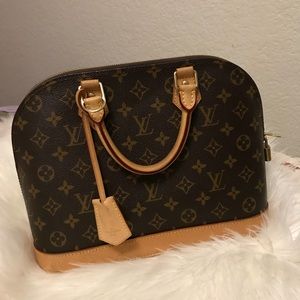 Authentic  Louis Vuitton Alma handbag